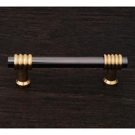 This Black Nickel And Polished Brass Finish Standard Size Cabinet Pull