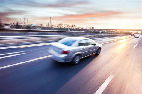 car driving  freeway  sunset motion blur autokreditorg