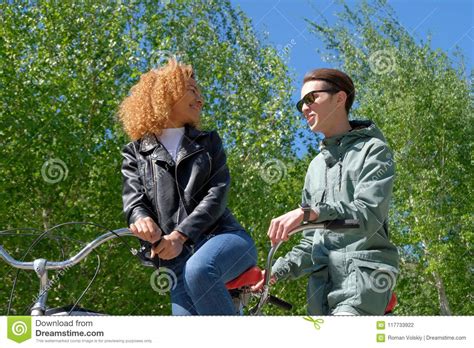 modern life style of international youth a black girl with fair hair