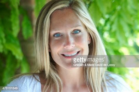 portrait of mature woman with blonde hair and blue eyes bildbanksbilder