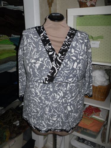 The Back Neckline Has A Self Fabric Turned Down Binding As