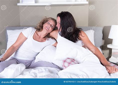 Two Attractive Women Hugging Each Other In Bed Stock Image Image