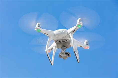 drone flying  clear blue sky stock photo image  copter horizontal