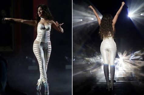 camila cabello shows off her curves in strappy catsuit