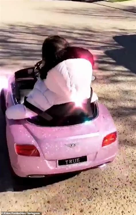 khloe kardashian shares sweet video   month  true riding    pink toy bentley