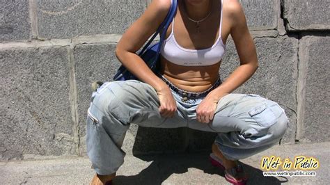 chick squats down and a powerful spurt of pee bursts through her pants pichunter