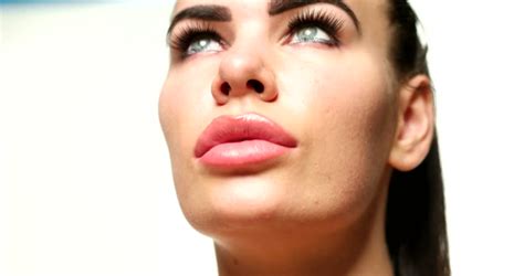 make up artist applies lip gloss to model close up stock footage video 4539395 shutterstock