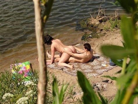 naked couple caught fucking on the beach nude beach pictures