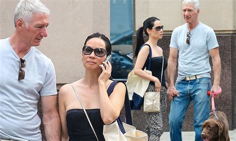 lucy liu strolls hand in hand with mystery man as pair enjoy a spot of antiques shopping daily