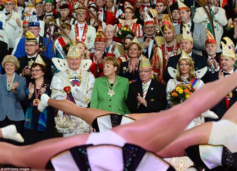Angela Merkel Looks Away As Female Dancers Perform The
