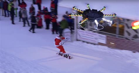 human carrying drone lift  snowboarder   mountain  verge