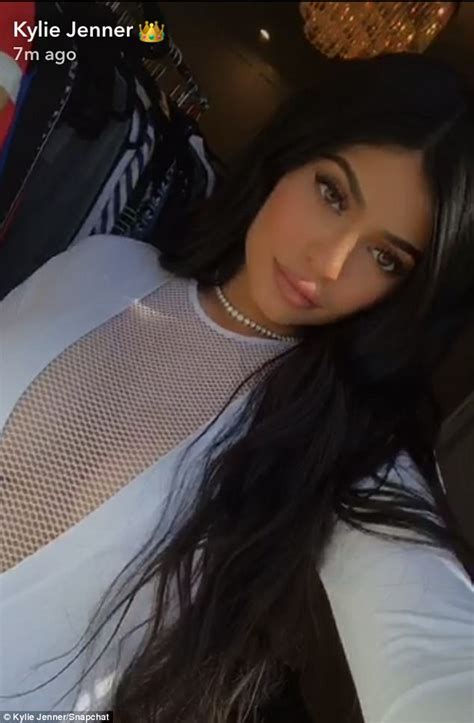 Kylie Jenner Flashes Her Bountiful Bosom In White Mesh Top Daily Mail