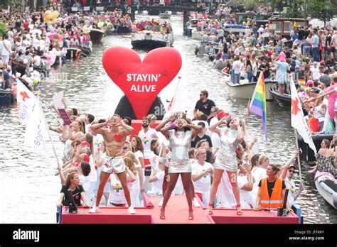 revelers on the boat in the prinsengracht canal participating in the