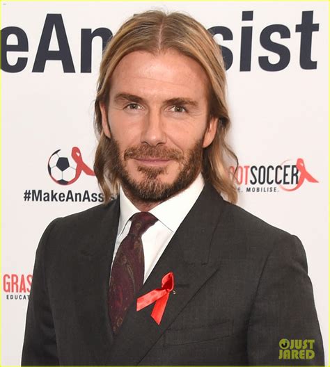 david beckham lets his long hair flow at world aids day event photo
