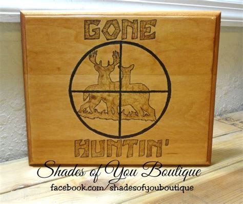 huntin wood burned plaque featuring deer   sights