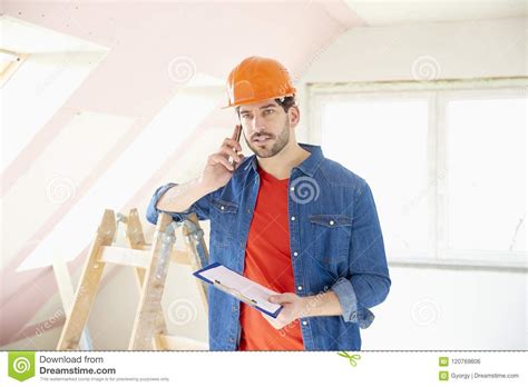 young handyman   mobile phone stock photo image  cell phone