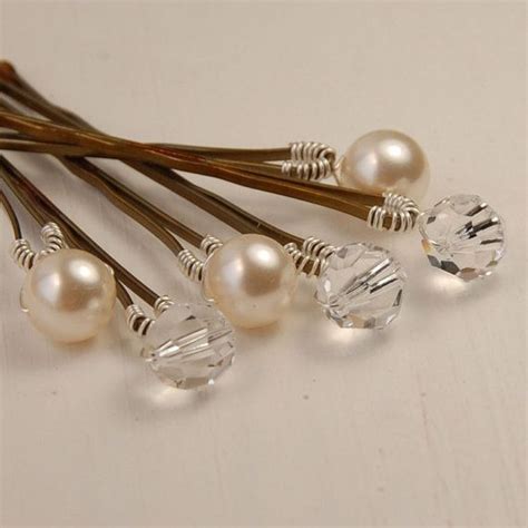 a bobby pin set with pearls and crystals offers an elegant