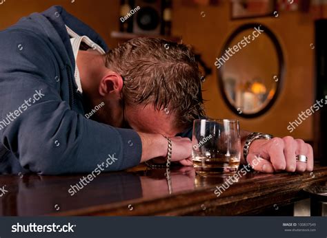 Lonely Drunk Man Who Has Had One Too Many Glasses Of Alcohol At The Bar
