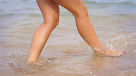 female legs  sea waves close   woman stock footage sbv