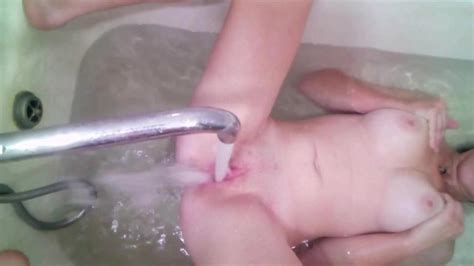 belarusian teen masturbates pussy with a stream of water in the