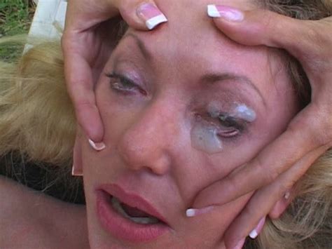 blonde whore gets sperm right in her eyes after wild titjob in the open air