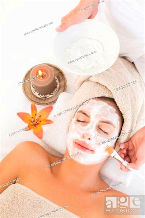 attractive woman receiving treatment  spa center stock photo
