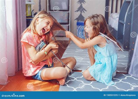 Two Little Mad Angry Girls Sisters Having Fight At Home Stock Image