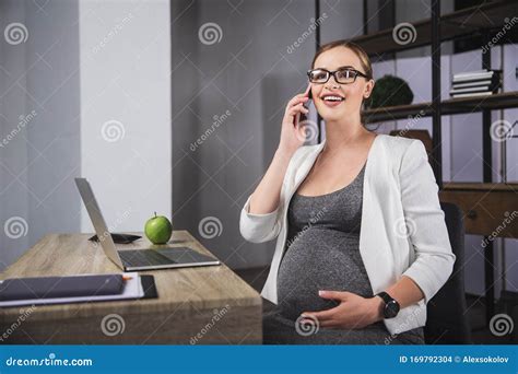 Pregnant Business Woman Working At Office Motherhood Sitting Phone Call