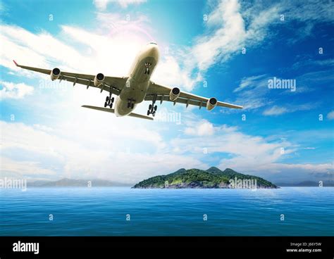 passenger plane flying  beautiful blue ocean  island  purity