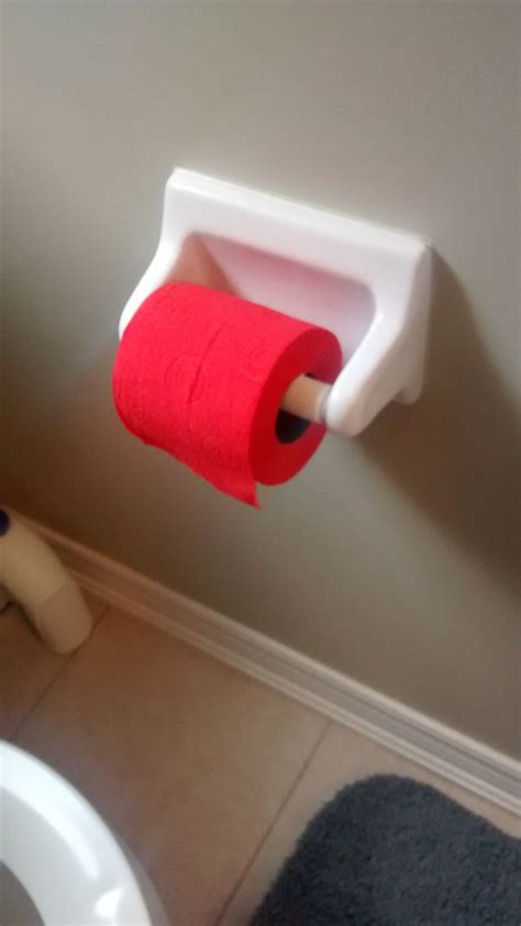 this bathroom has red toilet paper mildlyinteresting