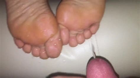 foot fetish milf rubbing balls with her sexy toes huge cumshot on soles