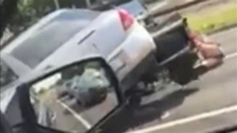 video shows car run over motorcycle in stunning road rage incident