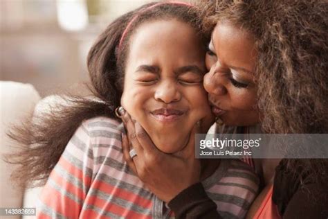 mom daughter kiss photos and premium high res pictures getty images