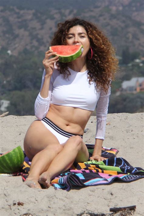 blanca blanco in a bikini doing a photo shoot on the beach
