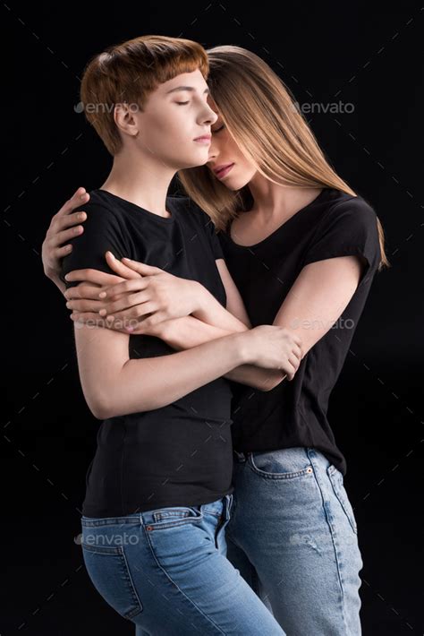 Half Length Shot Of Sensual Lesbian Couple Hugging With Their Eyes