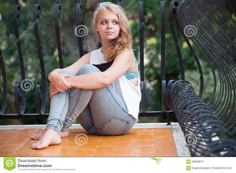 Beautiful Blond Caucasian Teenage Girl On Balcony Stock