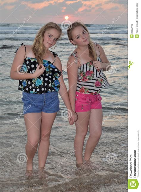 Two Girls Blonde On The Beach At Sunset Royalty Free Stock