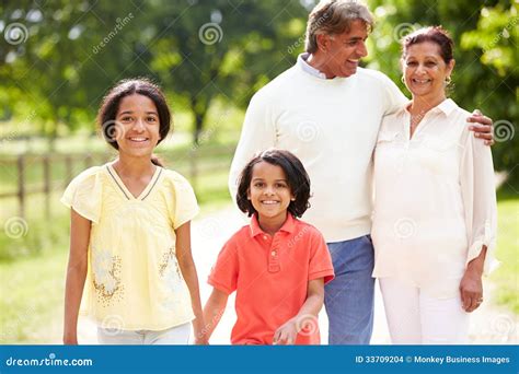 indian grandparents  grandchildren walking  countryside stock