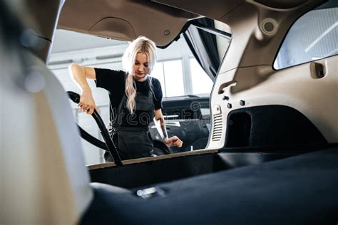 Worker Woman Vacuum Cleaning Dust Interior Inside Car In Car Wash