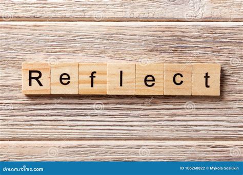 reflect word written  wood block reflect text  table concept