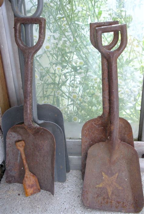 rusty shovels shovel rusty garden tools primitive