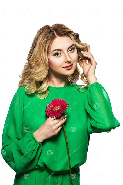 Beautiful Blonde Woman In A Green Dress Folded Her Hands Near The Face