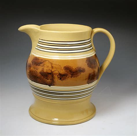 antique pottery yellow ware mocha decorated english pitcher  john howard
