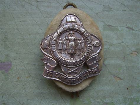 a vintage life saving guards girl guards badge pin lapel