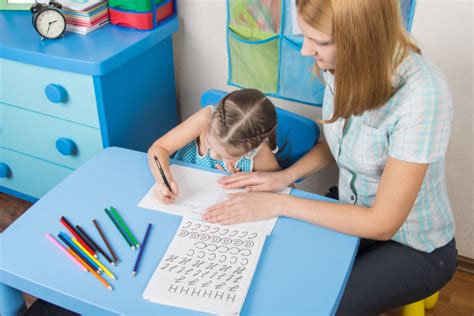 mentor   year  child learning spelling stock photo