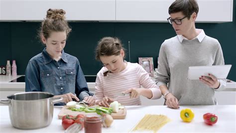 mom teaches daughter to cook stock video footage 4k and