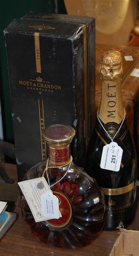 boxed moet  chandon champagne  grand vintage    remy martin champagne