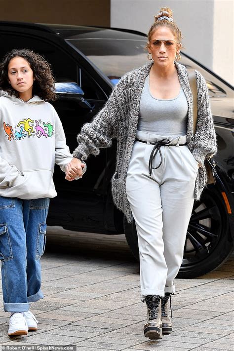 Jennifer Lopez Is One Stylish Mom With Her Hoop Earrings As She Holds