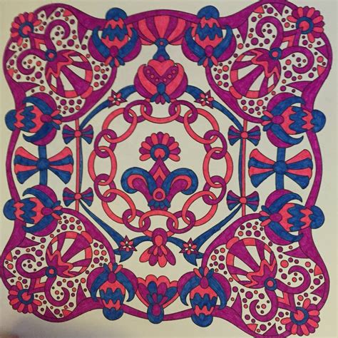 intricately designed piece  paper  pink blue  red designs