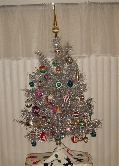 shiny happy christmas tree we had one of these in our rec room in the 70 s my mom used